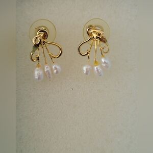 Gold and White Floral Earrings.